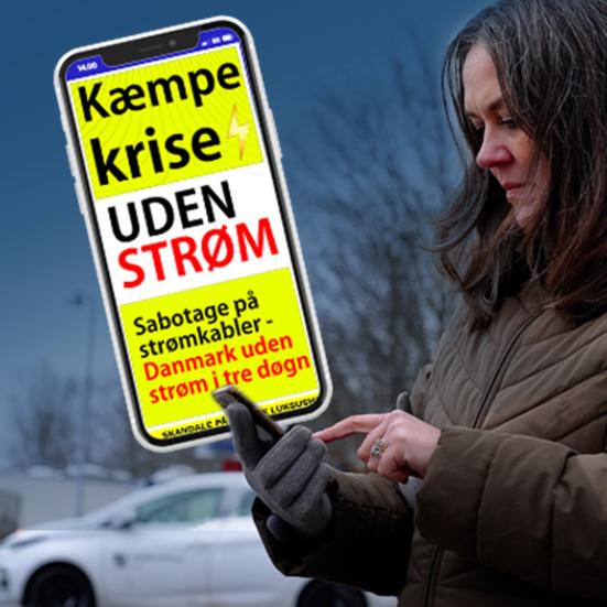 Mobiltelefon med breaking news i gule bjælker